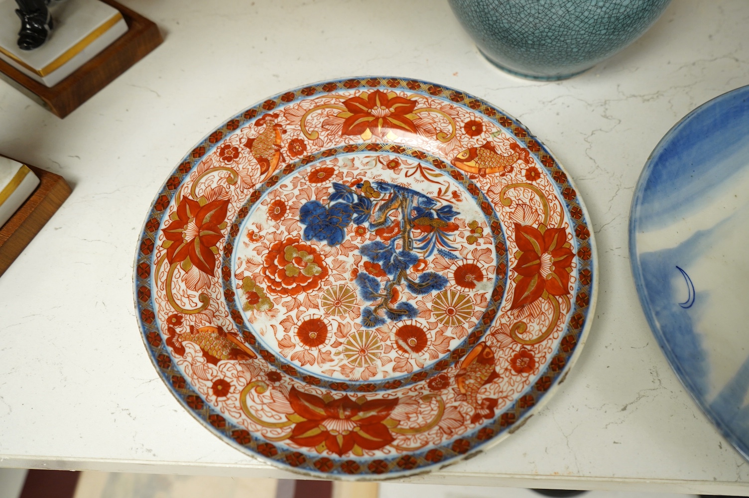 Two Chinese porcelain vases including a crackle glaze example and two plates, largest 23cm high. Condition - poor to fair